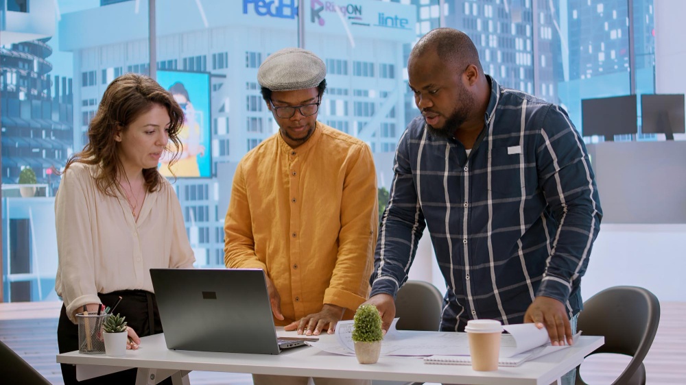 A team of diverse professionals collaborating on a digital project.